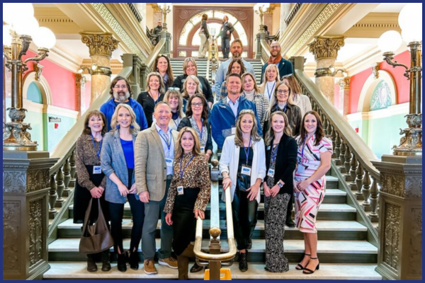 photo of adults standing in the capitol building