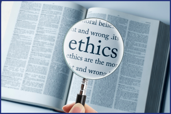 a book with a magnifying glass focused on the word ethics
